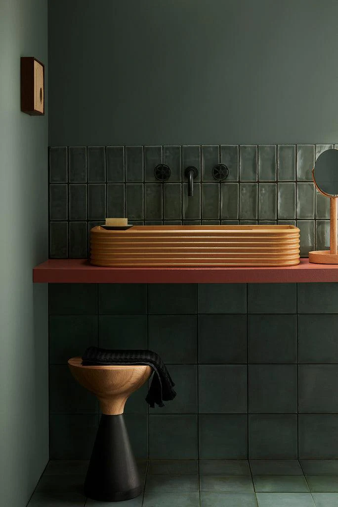 Bathroom painted in green.