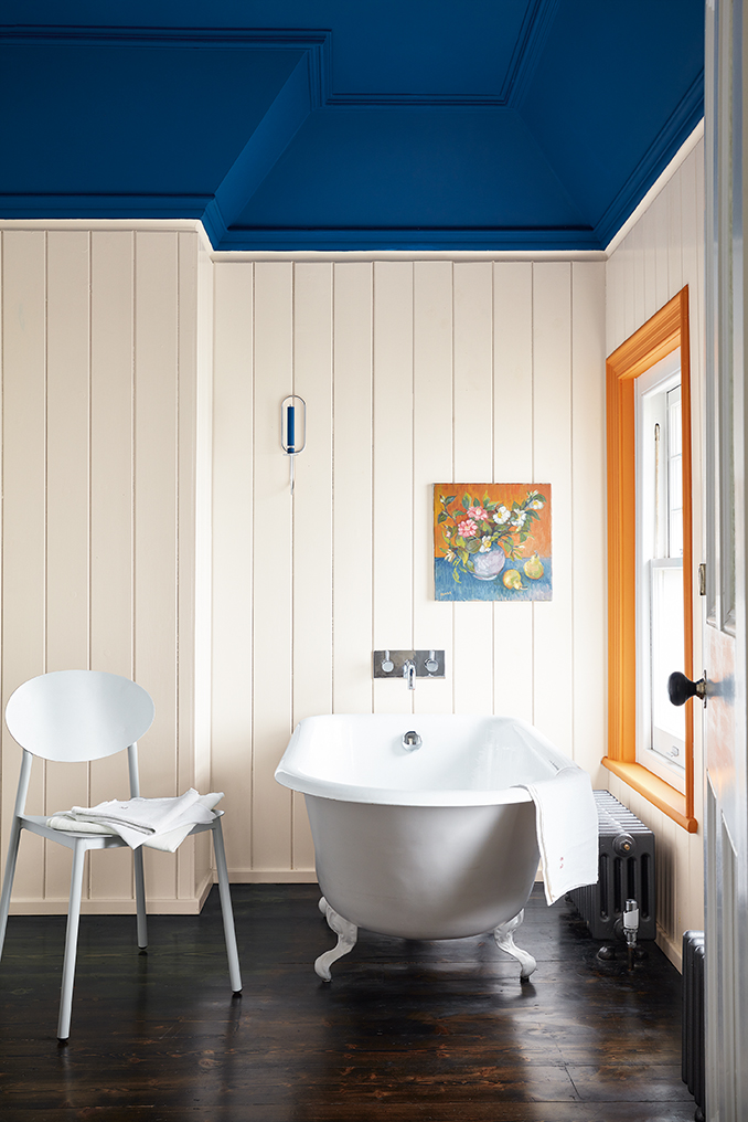 Bathroom decorated with feature ceiling in 1970s deep space blue.