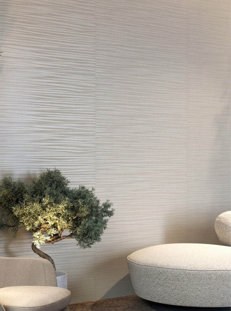 Treviso Wallcovering with bonsai tree and and beige sofa and armchair in foreground.