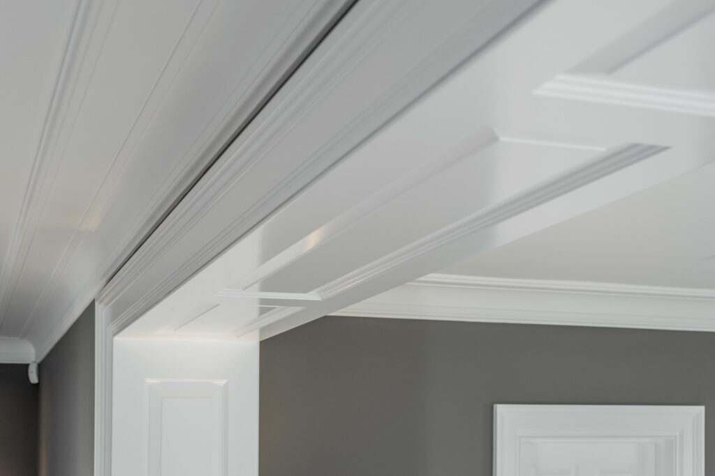 Detail of coffered ceiling and cornice work in a contemporary interior scheme.