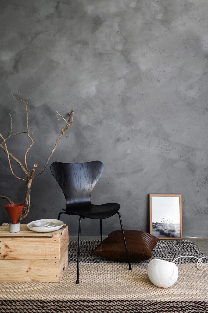 Modern rustic room with textured walls painted in Bauwerk’s Riverstone limewash, complemented by natural wood tones, linen textiles, and soft ambient lighting.